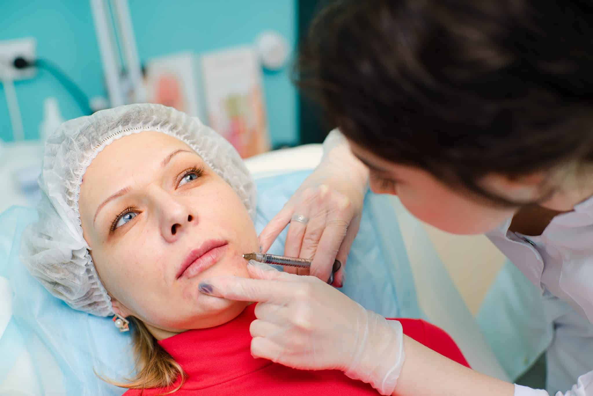 Woman receiving Acid Based Filler injection